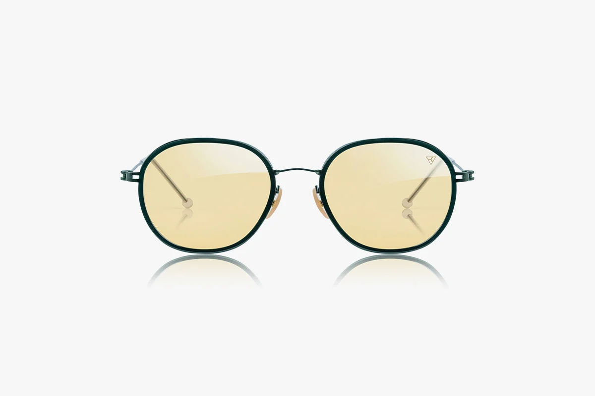 Round sunglasses with yellow-tinted lenses on a white background  Hyperlight Optics' revolutionary Fullerene C60 lens technology transforms light 
